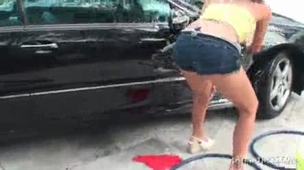 Busty latina siren washing the car in her swim suit