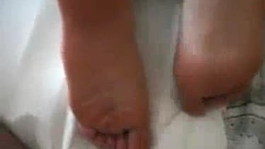 Wifes gets jizzed on her bare feet bottoms