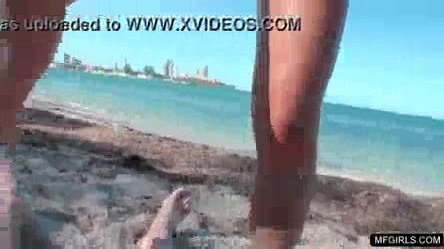 Busty wife takes it hard from the back on public beach