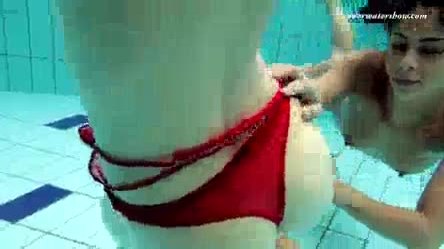 Lesbian fun underwater and naked stripping